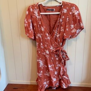 Orange floral sun wrap dress with flutter sleeves